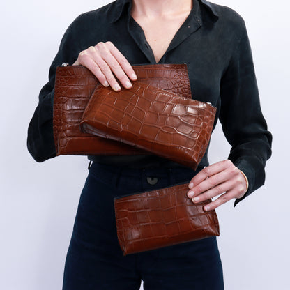 ESSENTIAL POUCH LIPSTICK POUCH EVERYDAY POUCH GROUP MODEL SHOT WEBSITE.JPG